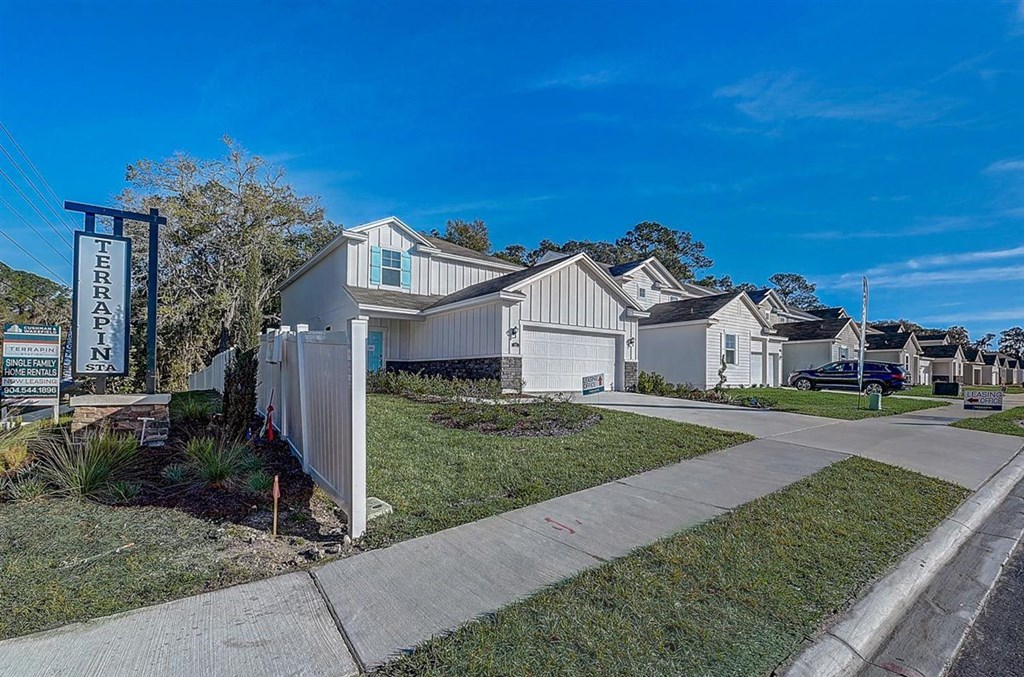 Terrapin Station single-family home rentals, white houses with blue accents.