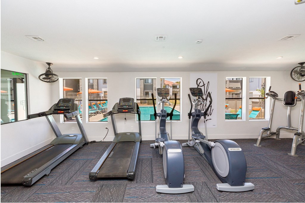 Apartments for Rent in Moreno Valley, CA - Sorelle Apartments - Picnic Area with Fence, Trees, Round Tables, and Benches