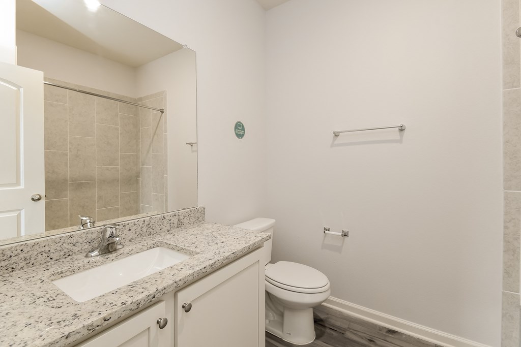 an empty bathroom with a toilet and a sink