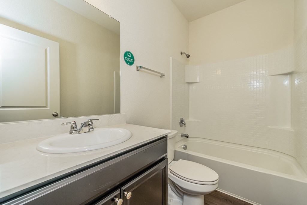 the preserve at ballantyne commons apartment bathroom with sink toilet and tub