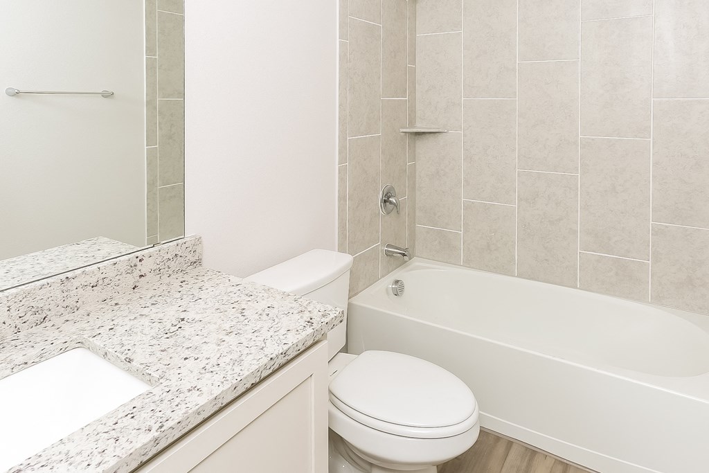 an image of a bathroom with a tub and a toilet