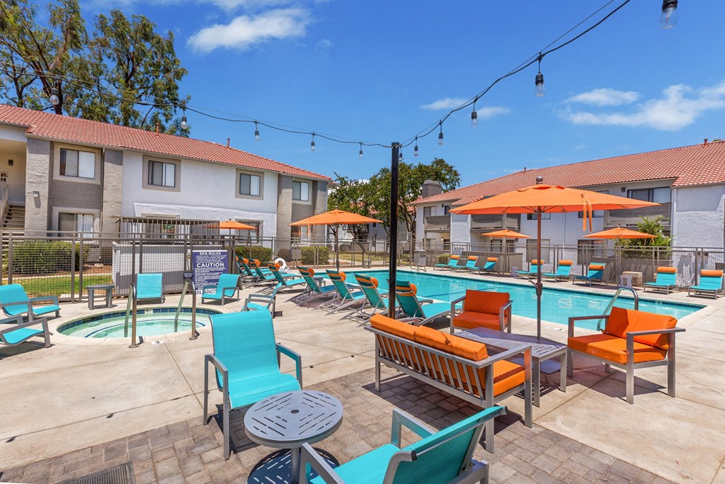 our apartments have a resort style pool with lounge chairs and umbrellas