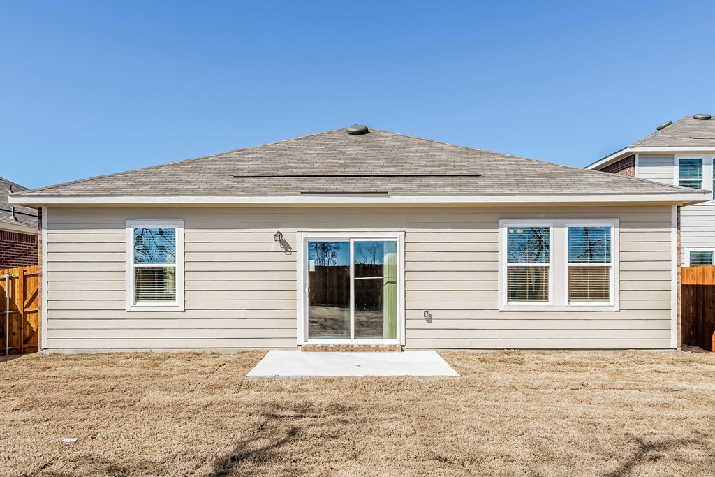 the front of a house with a yard and a door