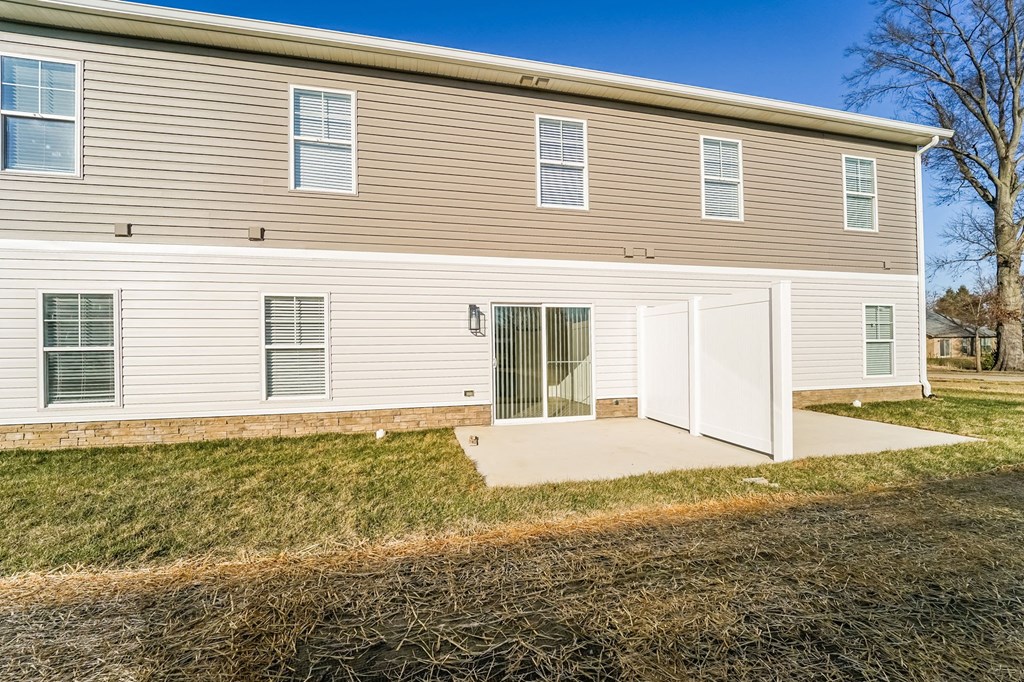 a white and brown house with a garage door