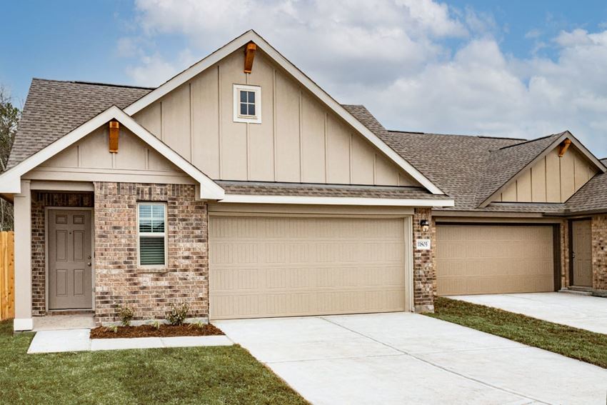 a house with a gray roof and a brown garage door - Photo Gallery 1