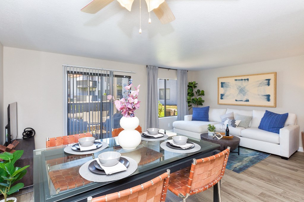 an open living room and dining room with a table and chairs