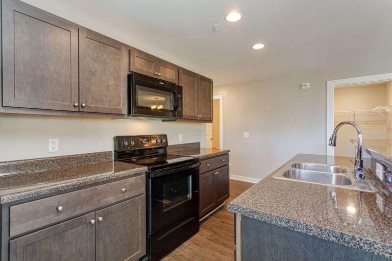 a kitchen with a sink and a stove