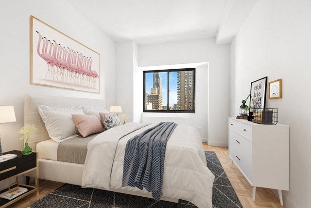 a bedroom with a bed and a window