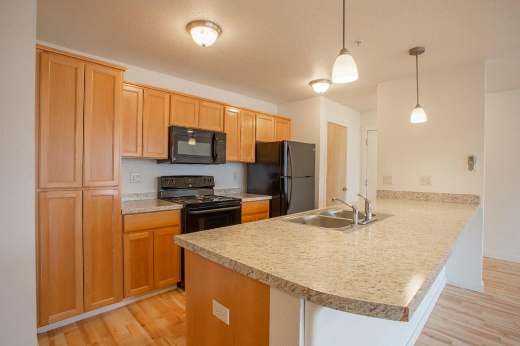 a kitchen with a granite counter top and a sink