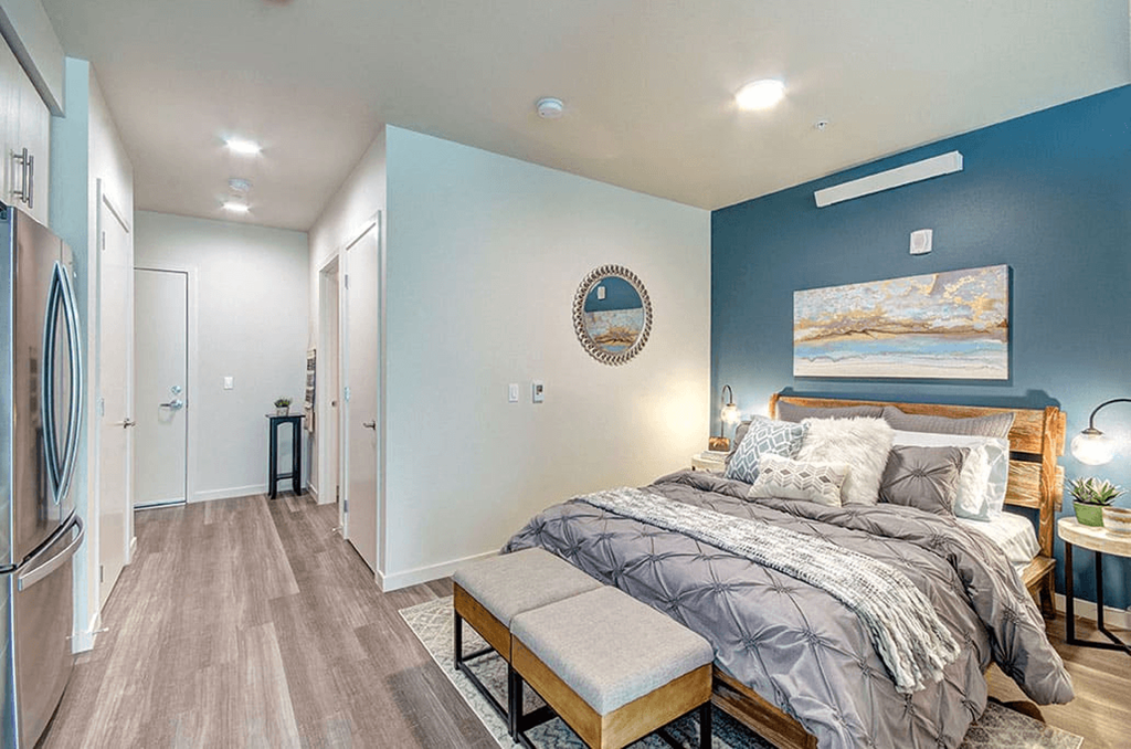 a bedroom with a bed and a closet