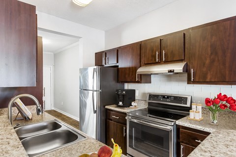 Atlanta, GA Apartments – One K Apartments – modern kitchen with stainless steel appliances