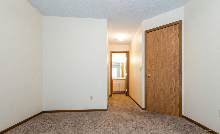 Bedroom next to bathroom