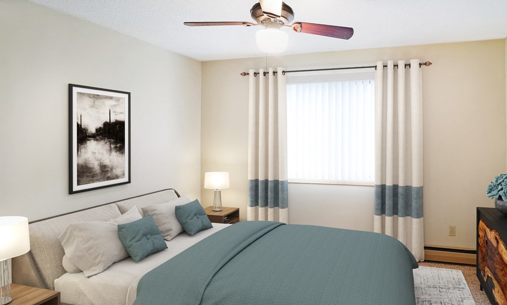 A bedroom with a bed, nightstand, and a ceiling fan.