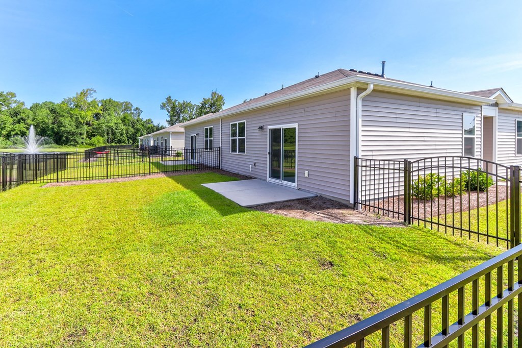 a 3d rendering of a house with a green fence