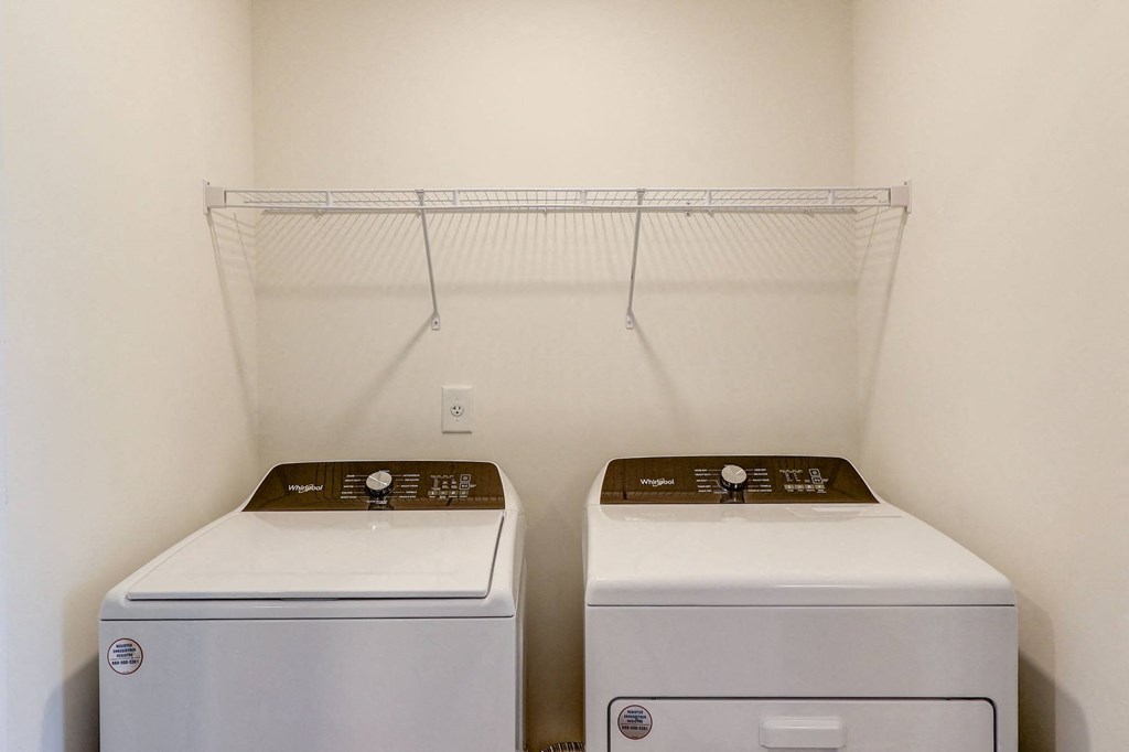 3-BR Townhomes In North Charleston, SC - Highland Townhomes - In-Unit Washer And Dryer With A Storage Rack
