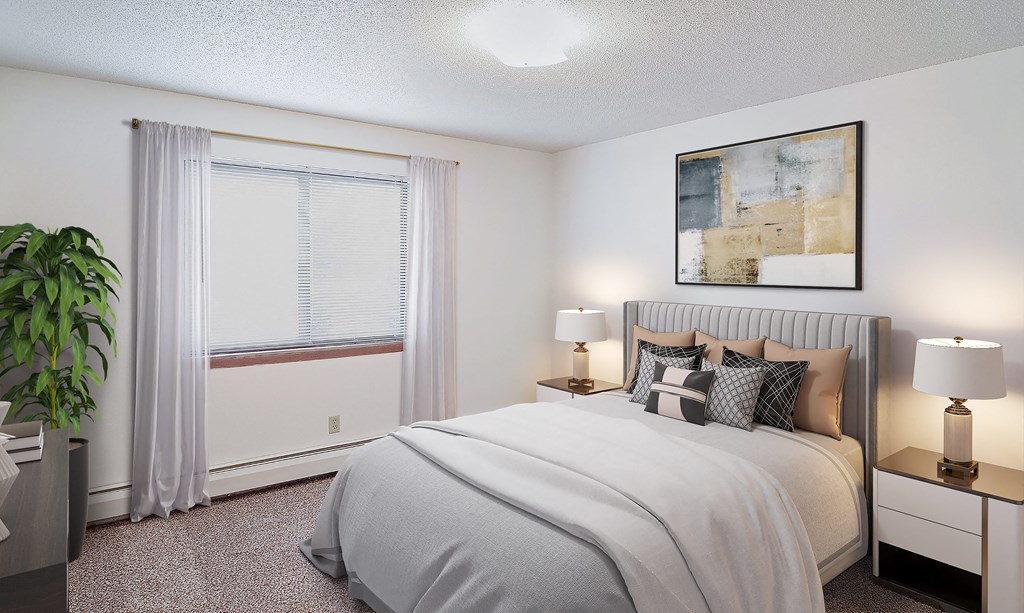 A bedroom with a large bed, a potted plant, and a window with curtains.