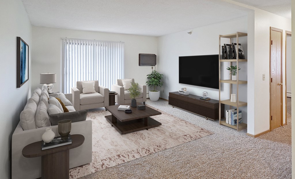 A living room with a white couch, a brown coffee table, and a flat screen TV.