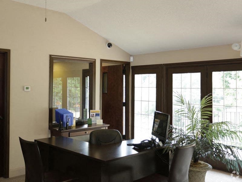 a desk with a computer on top of it