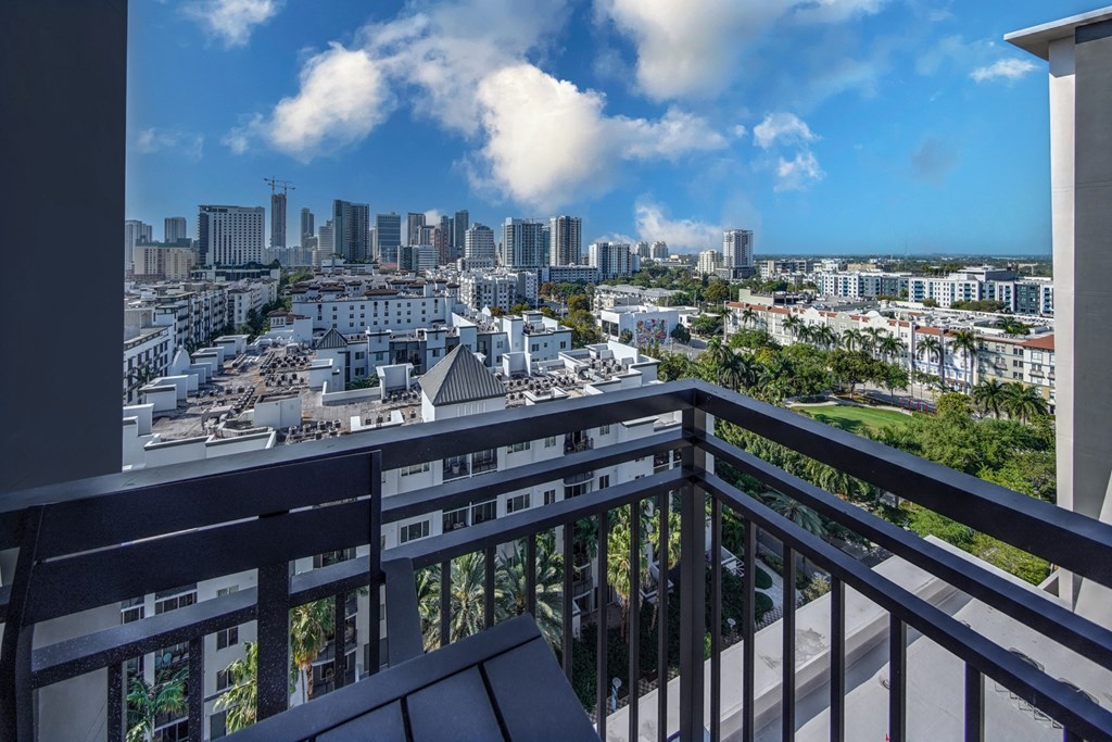 a view of the city from the balcony of a condo