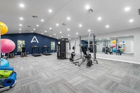 Fitness center with cardio and strength equipment at Averly Apartments in Jonesboro, GA