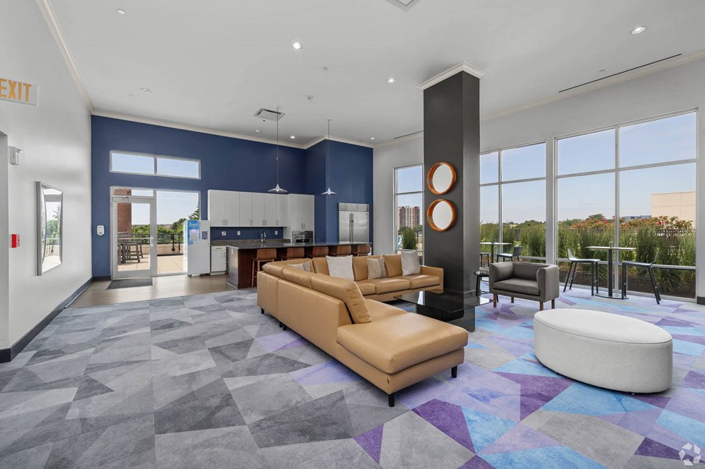 a large living room with couches and a table