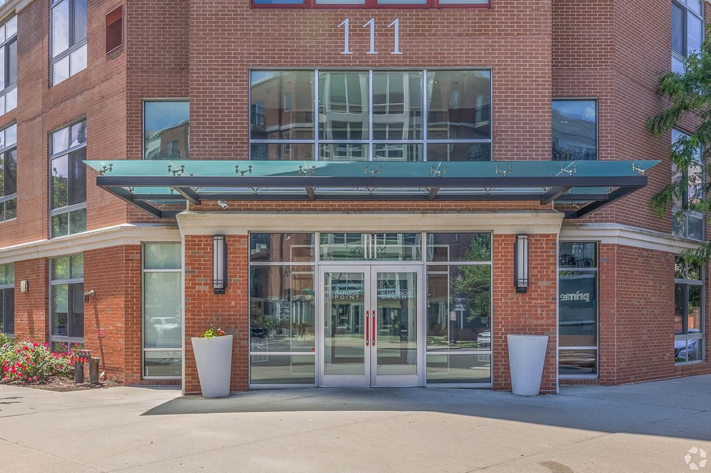 the entrance to a brick building with glass doors