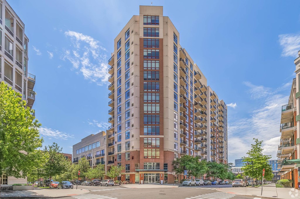 a view of a tall building on a city street