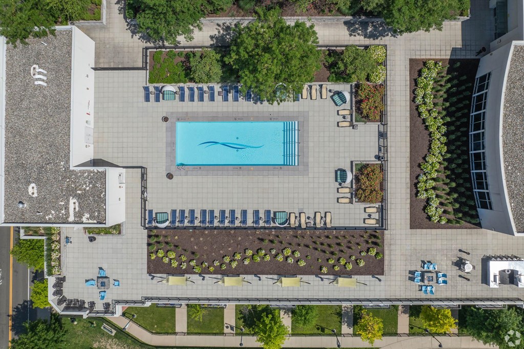 a birds eye view of a pool in the middle of a park