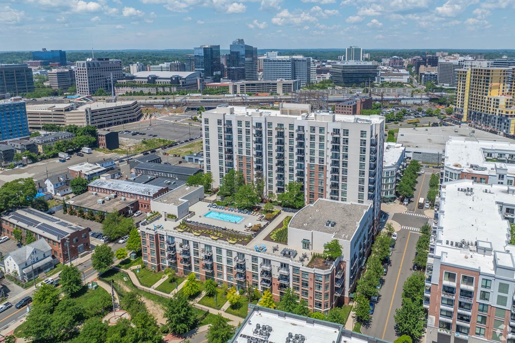 an aerial view of a city with tall buildings and trees