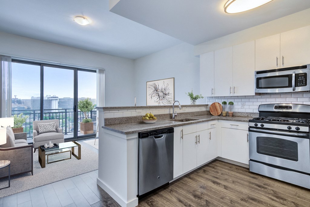 kitchen with stainless steel appliances and living room