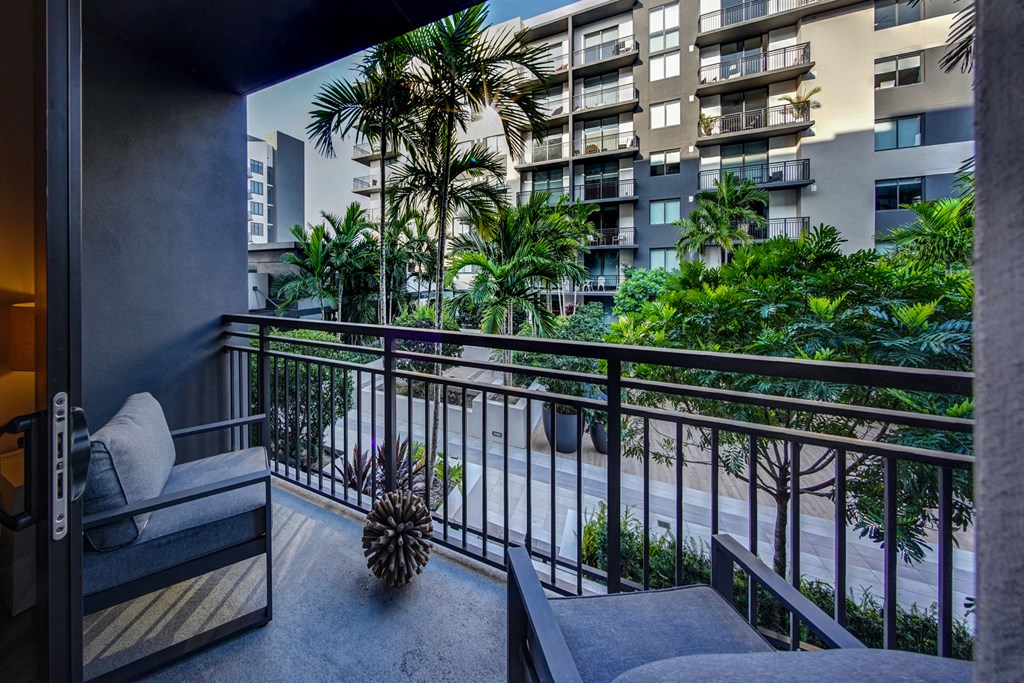a balcony or terrace with a view of a city