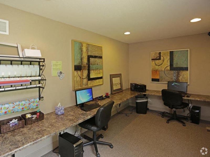 a room with two computers on a long counter