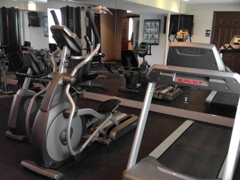 a room filled with lots of different types of exercise equipment