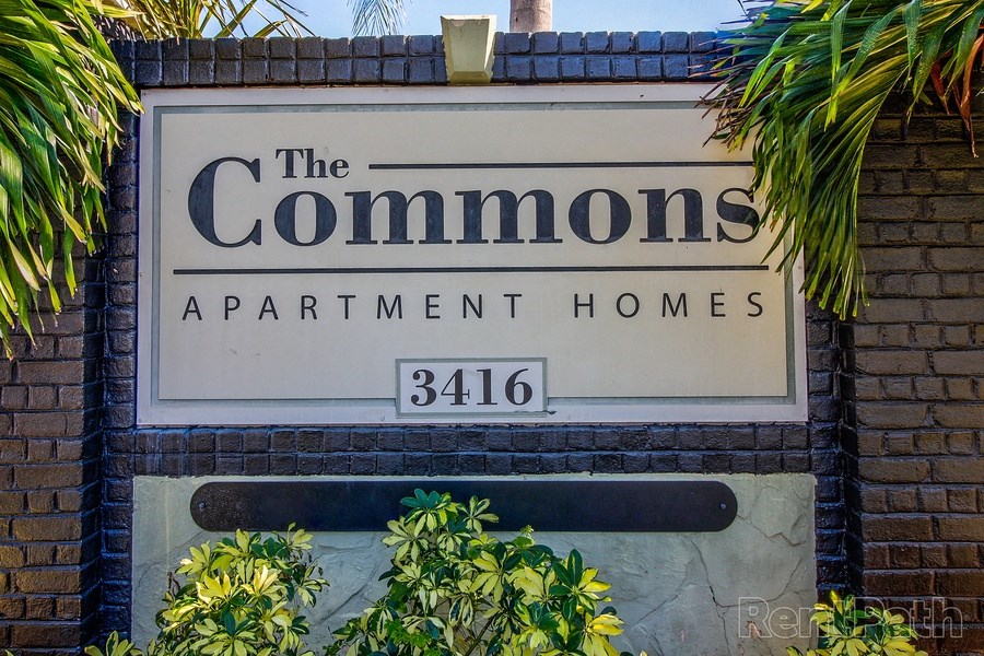 Property sign for The Commons apartment community in Tampa, Florida.
