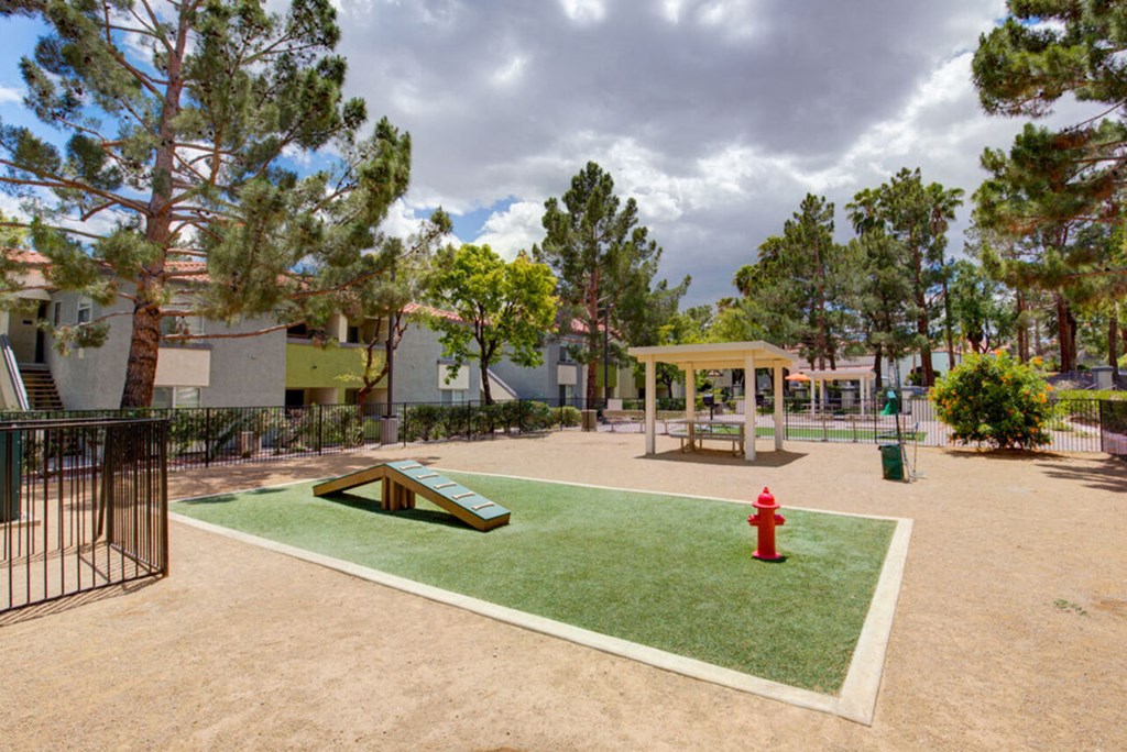 a park with a grass area and a fire hydrant