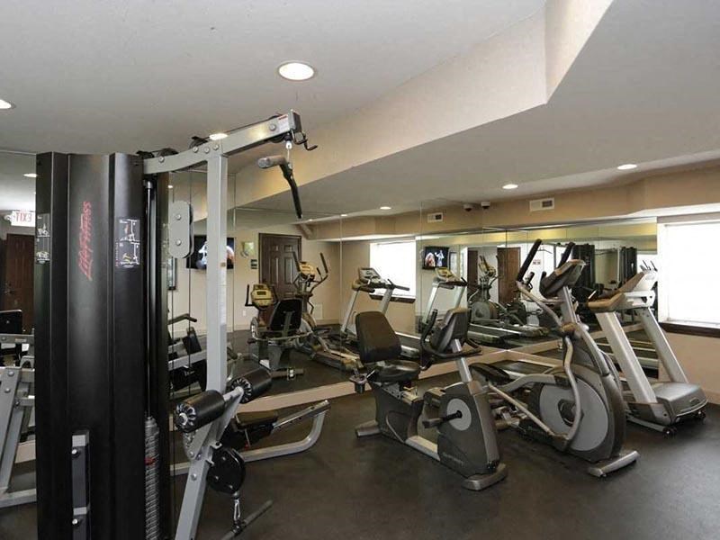 a room filled with lots of different types of exercise equipment
