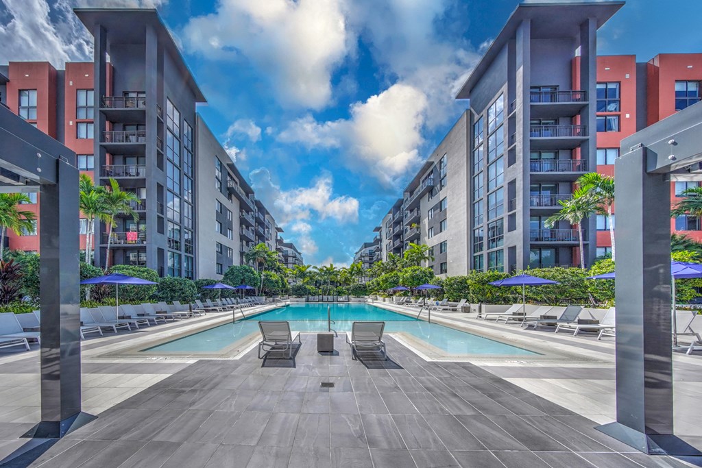 a swimming pool in the middle of an apartment building