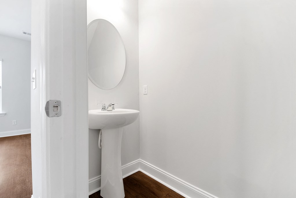 Cottonvale Towns in Savannah, GA photo of half bath with sink and mirror