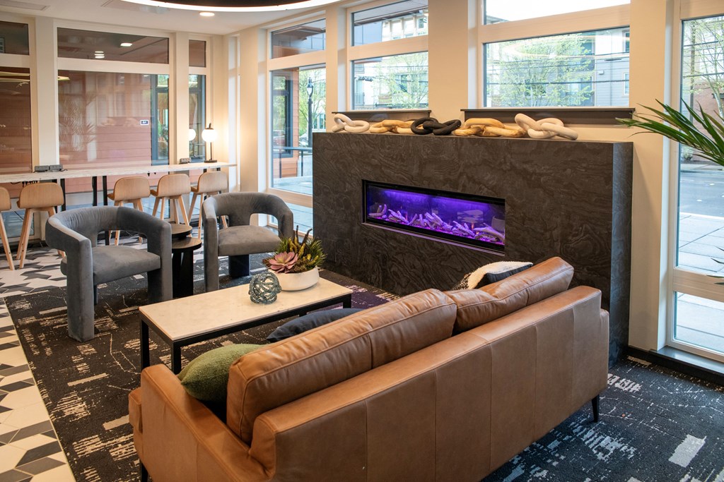 Studio Apartments in Bothell, WA - Morado Bothell - Community Lounge with Various Seating Options, Many Windows, and Stylish Decor