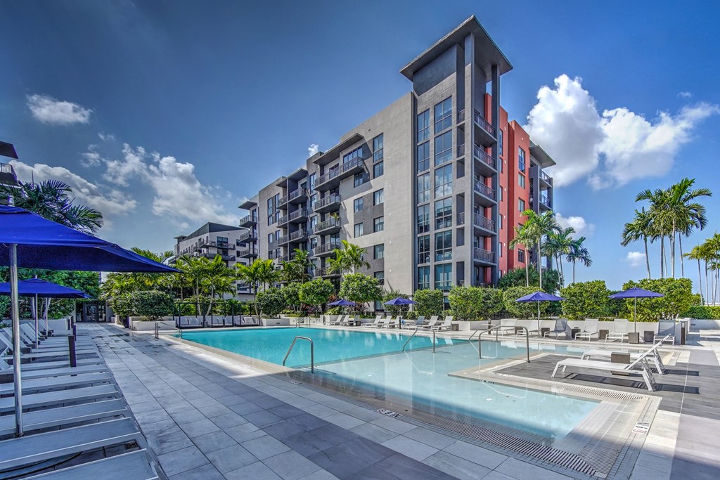 a swimming pool with a building in the background