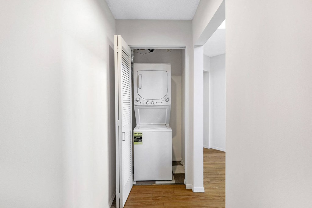 a room with a washer and dryer in it