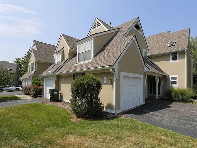 a house with a garage and a grassy yard