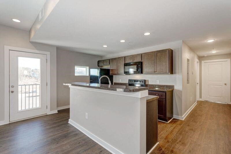 a kitchen with a counter top and a microwave