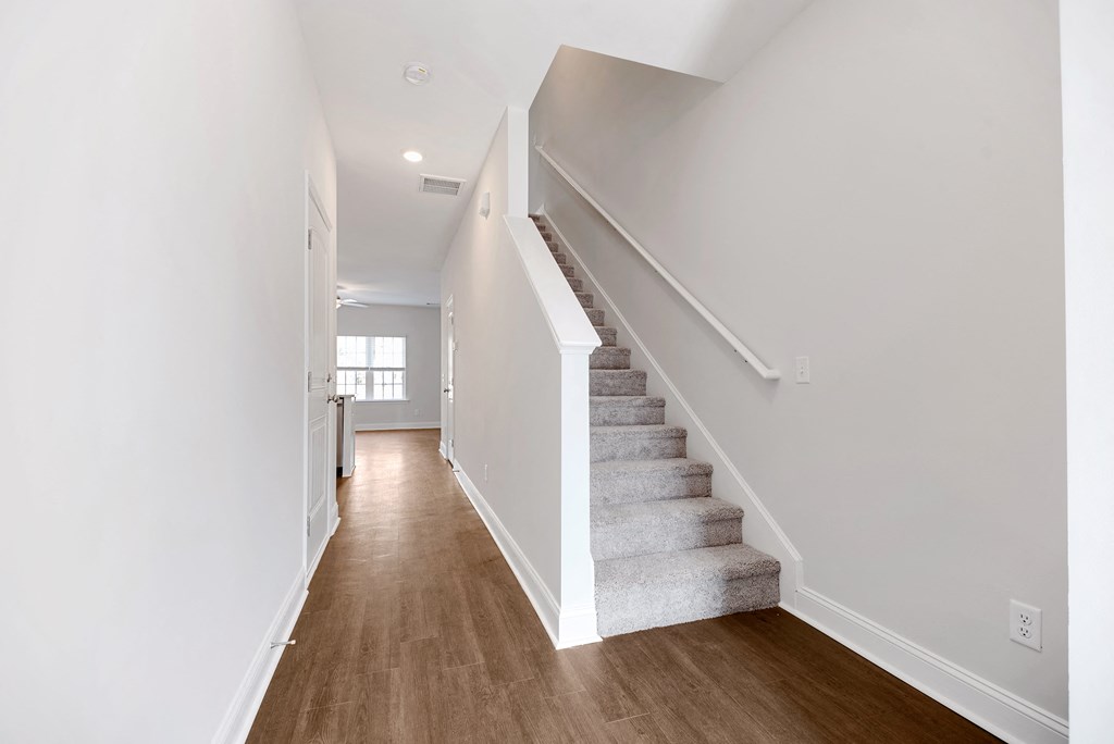 Cottonvale Towns in Savannah, GA photo of hallway with staircase leading to second floor
