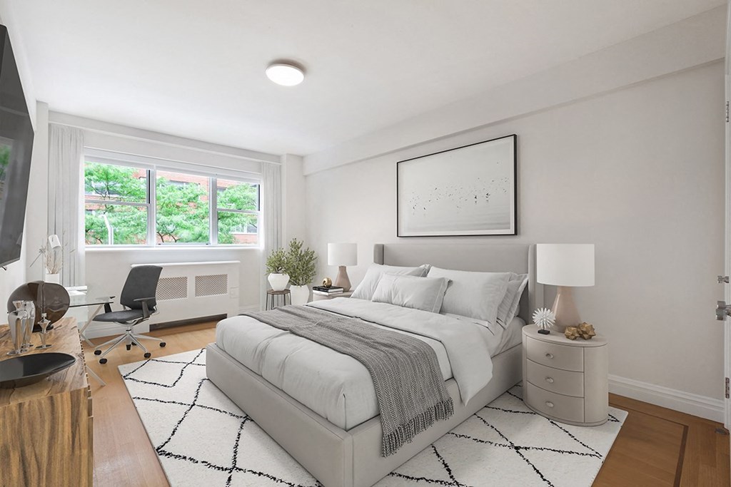 Apartments For Rent In Upper Eastside New York, NY - 85 East End Avenue - Spacious Bedroom With Windows Providing Beautiful, Expansive Views Of The City, A Ceiling Light, And Hardwood Strip Flooring