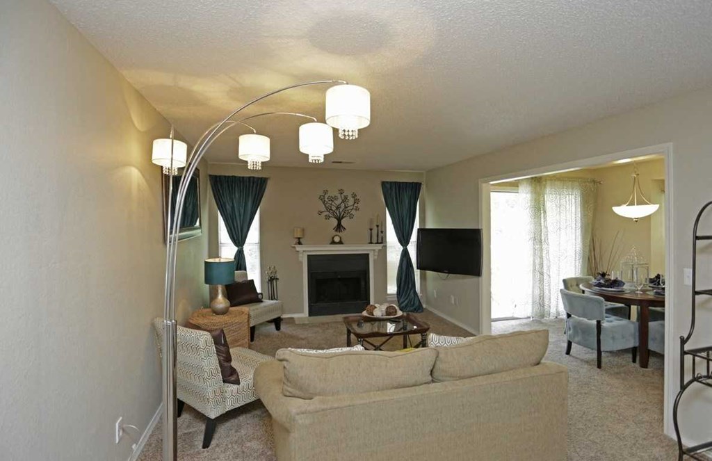 a living room filled with furniture and a fire place