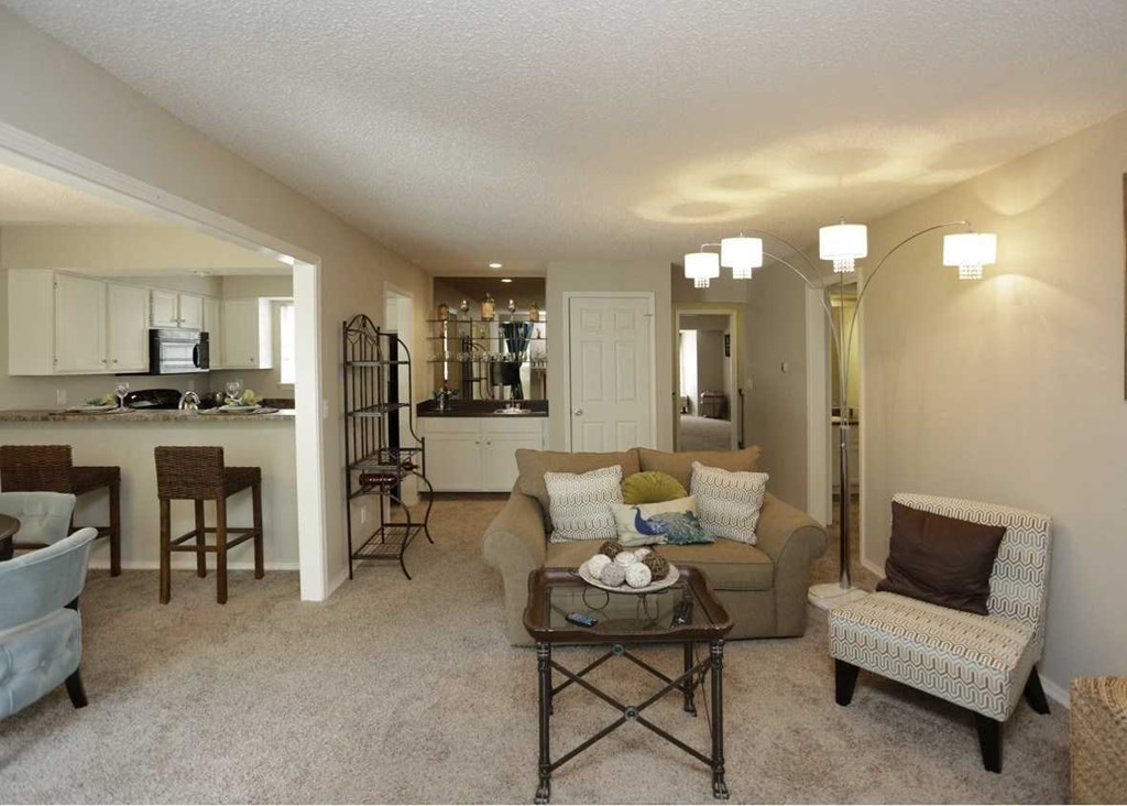 a living room with a couch a chair and a table