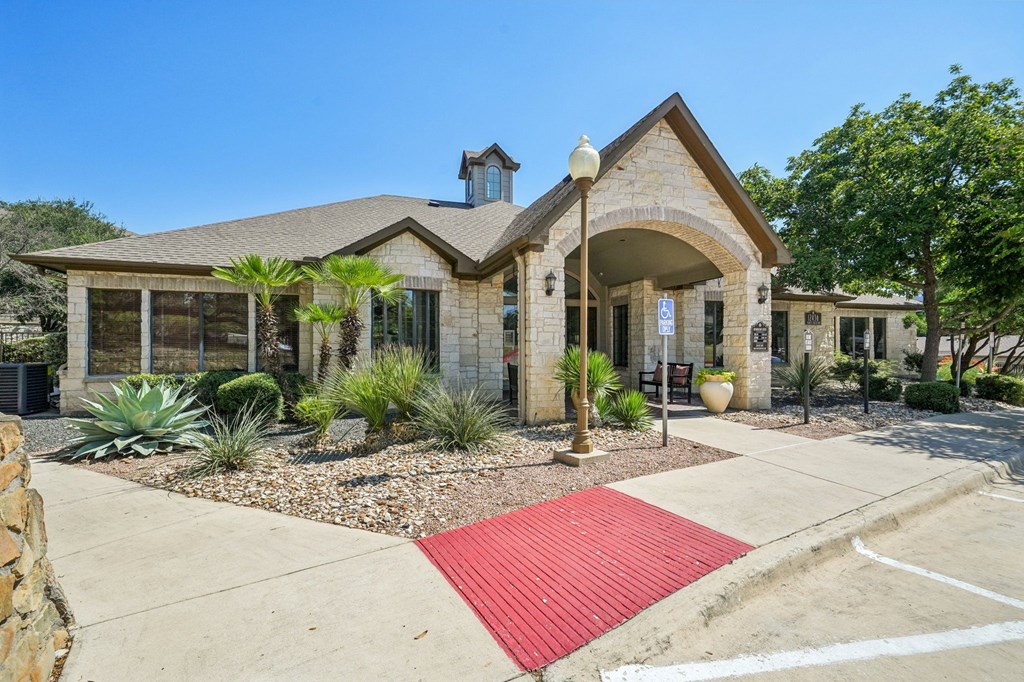 A house with a red mat in front of it.