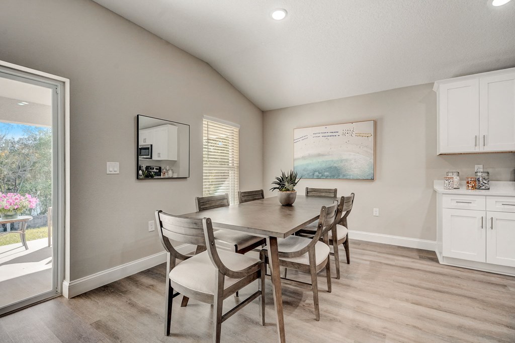 Dining room space at The Groves at Lake Ella in Lady Lake, Florida — a pet-friendly rental community.