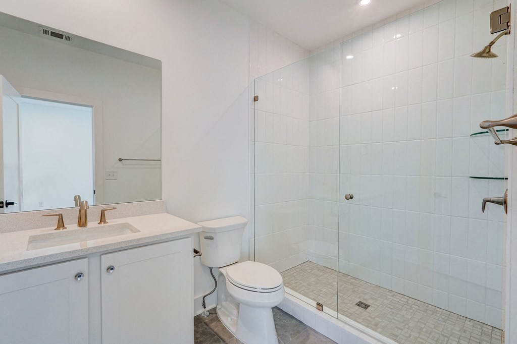 Bathroom with tub and shower in pet-friendly townhomes at Henley Avondale in Avondale Estates, GA.